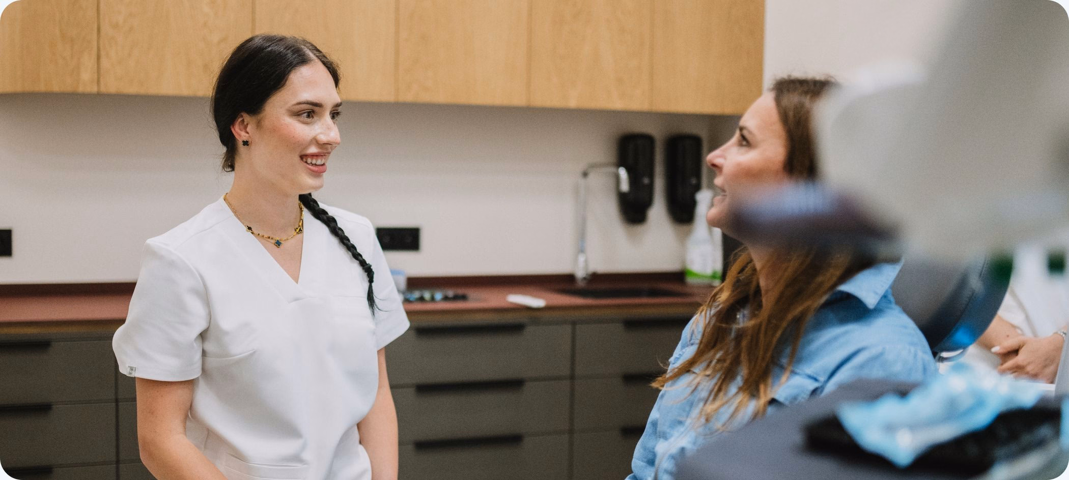 Flow Dental Studio hygienist at the dental chair Flow Dental Studio hygienist at the dental chair