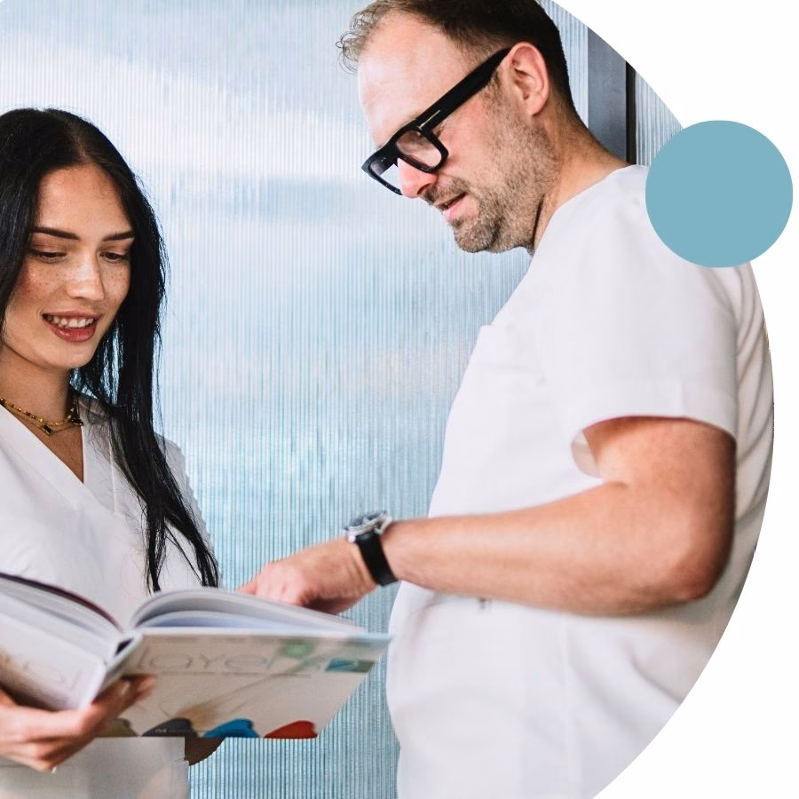 Adrian Kiepuszewski with an assistant at Flow Dental Studio